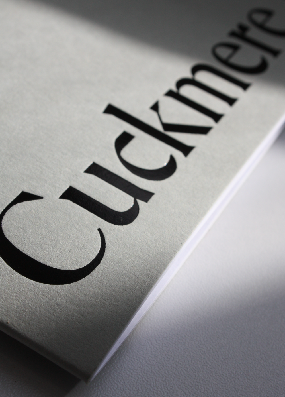 Black foiled logo on Colorplan Real Grey