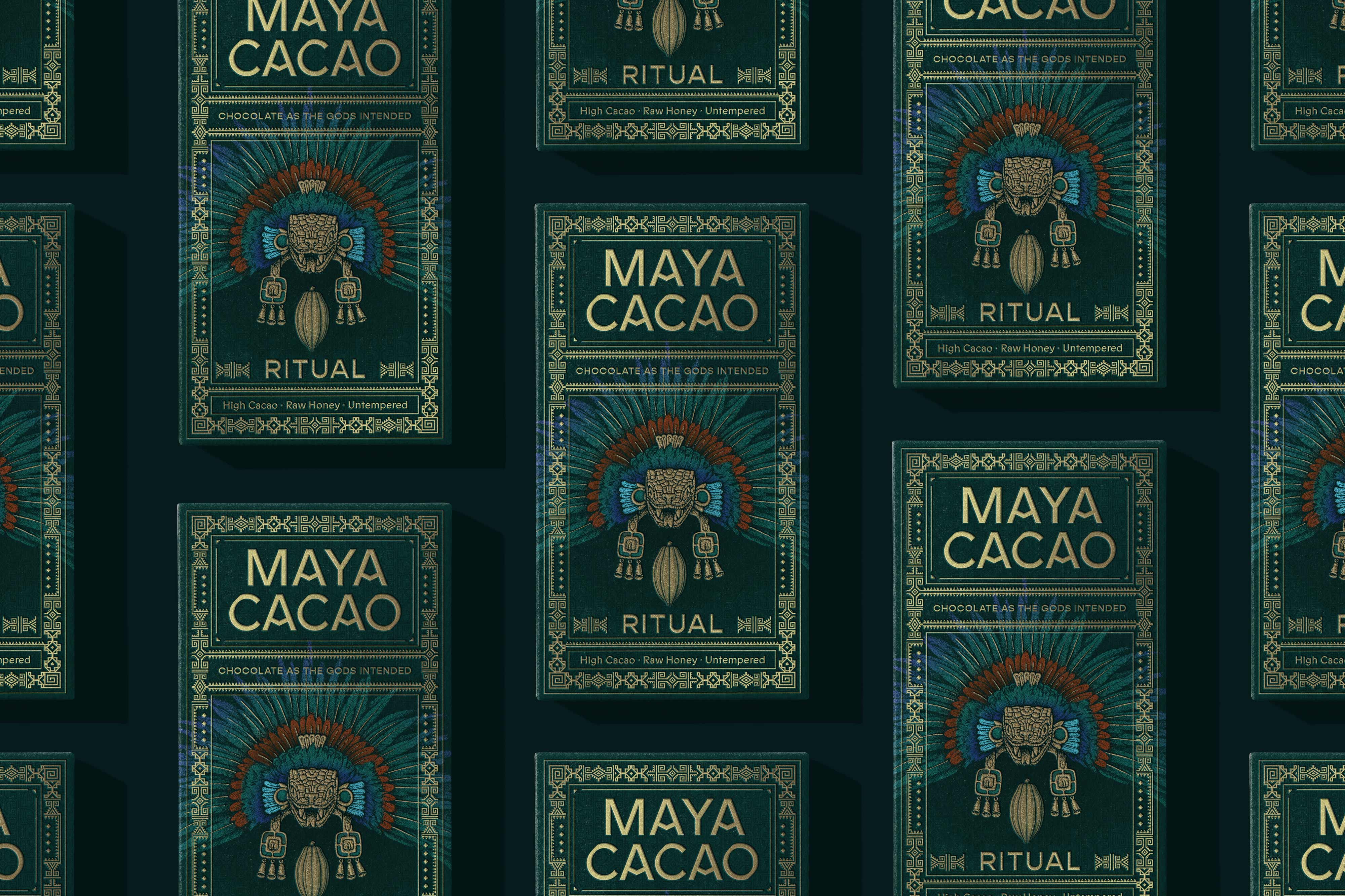 Mayan inspired dark green chocolate packaging with gold foil and a headdress