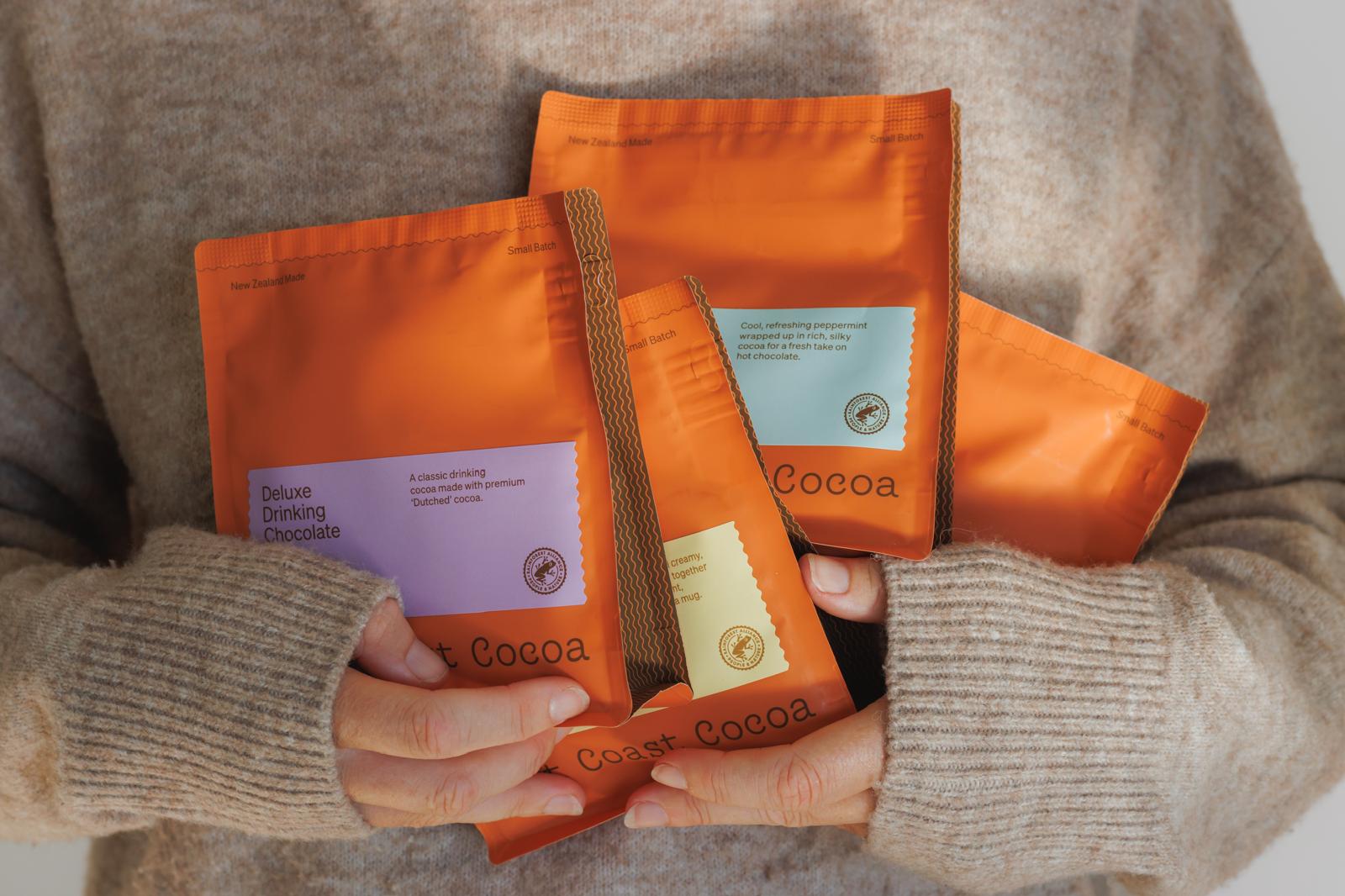 Red Ottolenghi coffee packaging on a dark red background